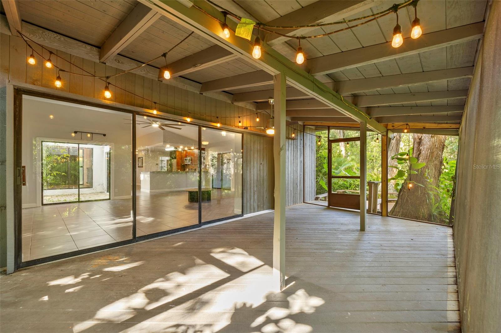Amazing screened back porch, perfect for watching sunrises, sunsets, and dinner parties.