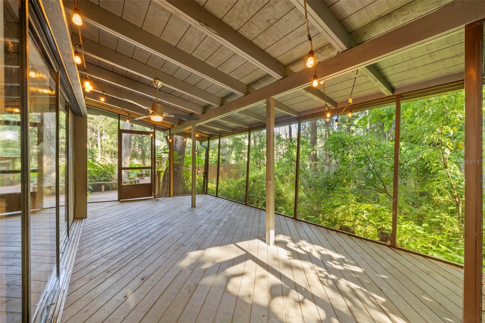 Amazing screened back porch, perfect for watching sunrises, sunsets, and dinner parties.