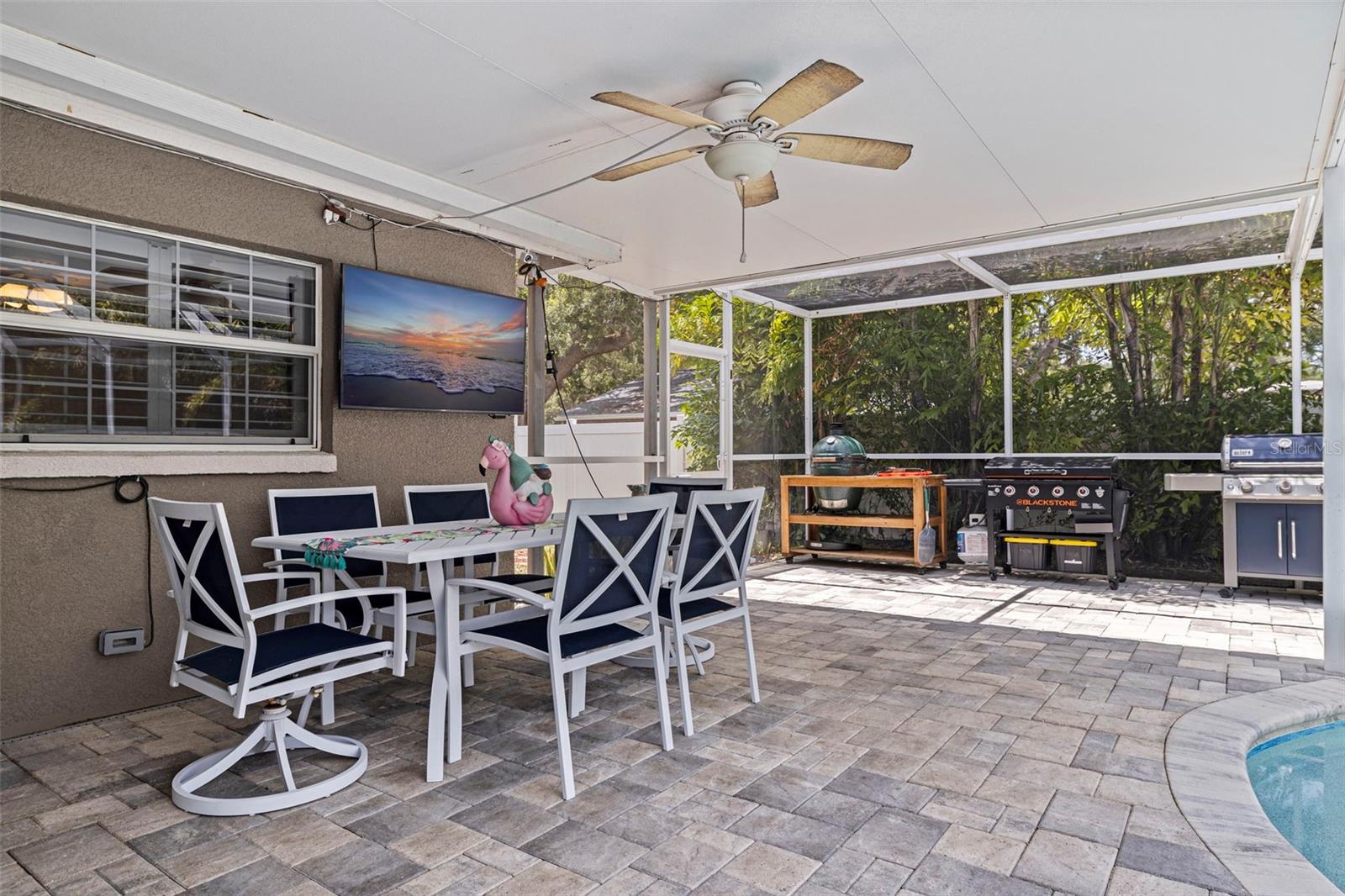 Covered pool lanai perfect for weekend barbecues!