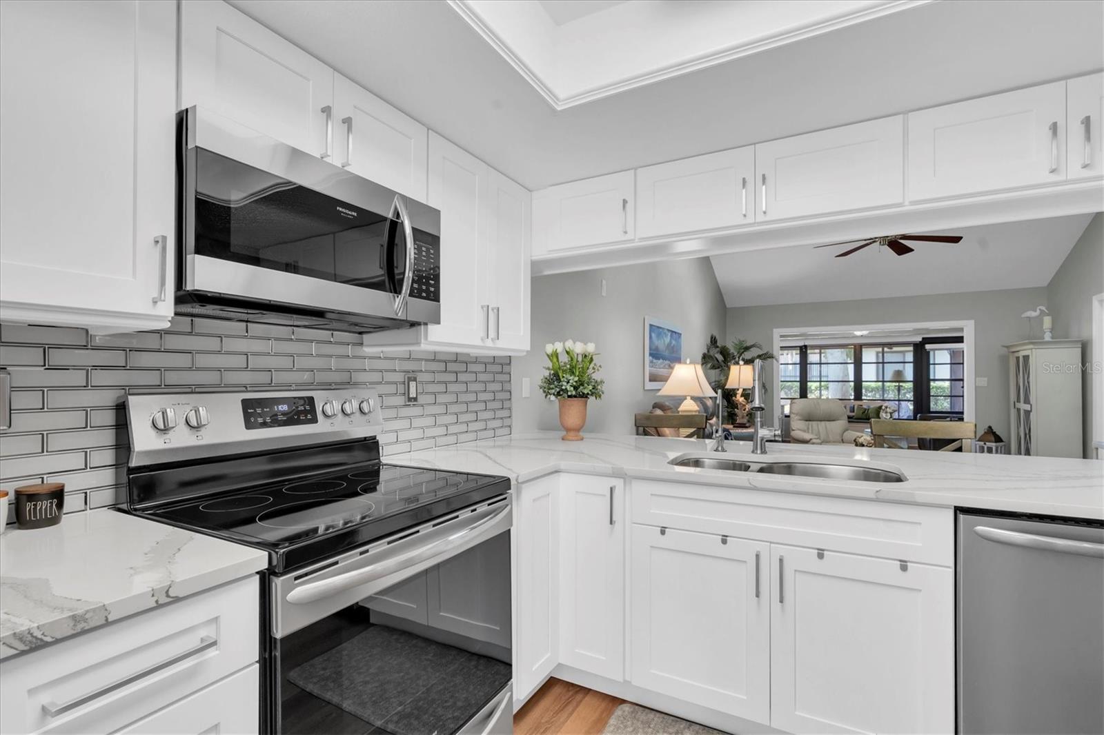 Beautiful new Kitchen with quartz counters, stainless appliances, and plenty of room for food prepping