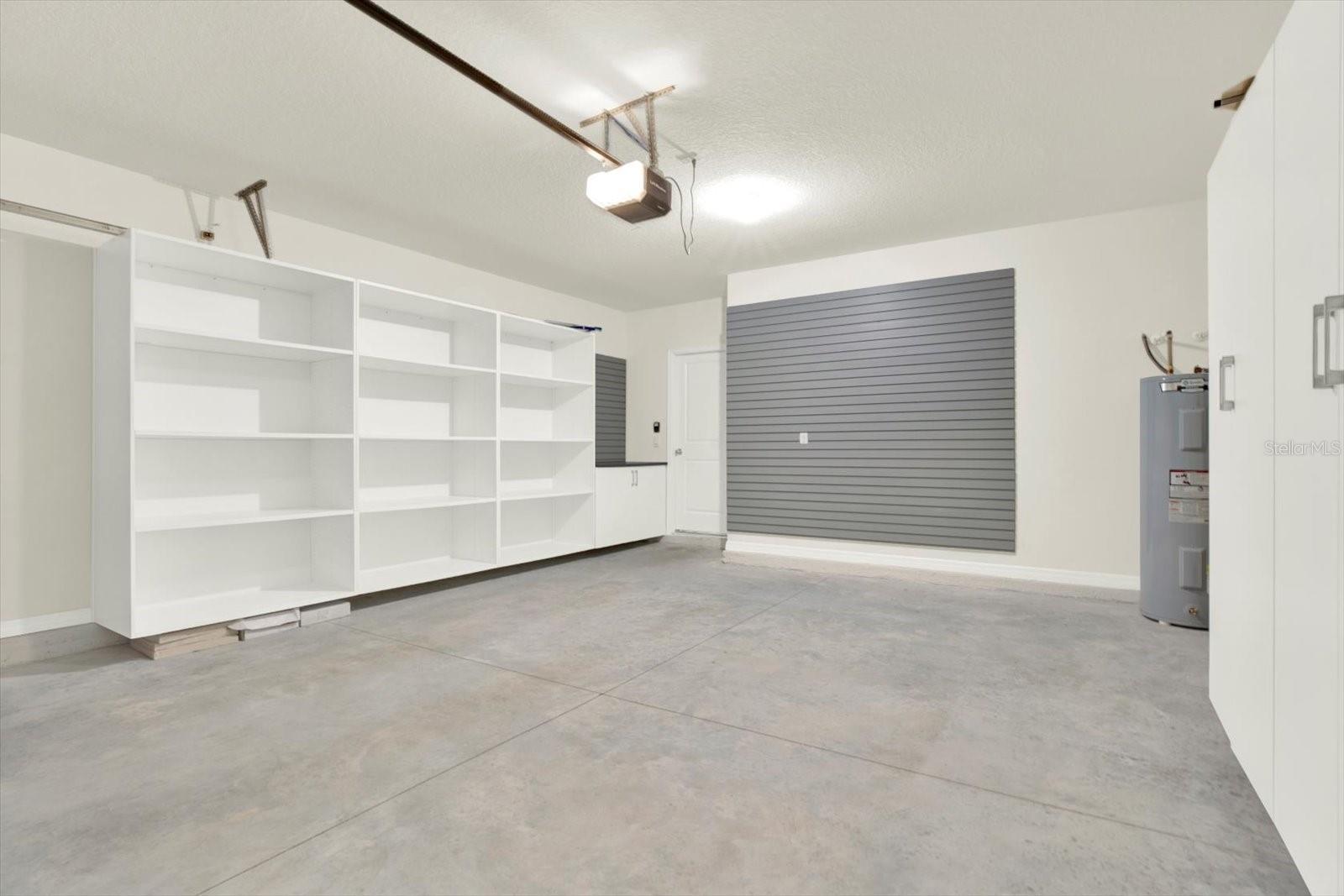 2 car garage with built in shelving & cart space