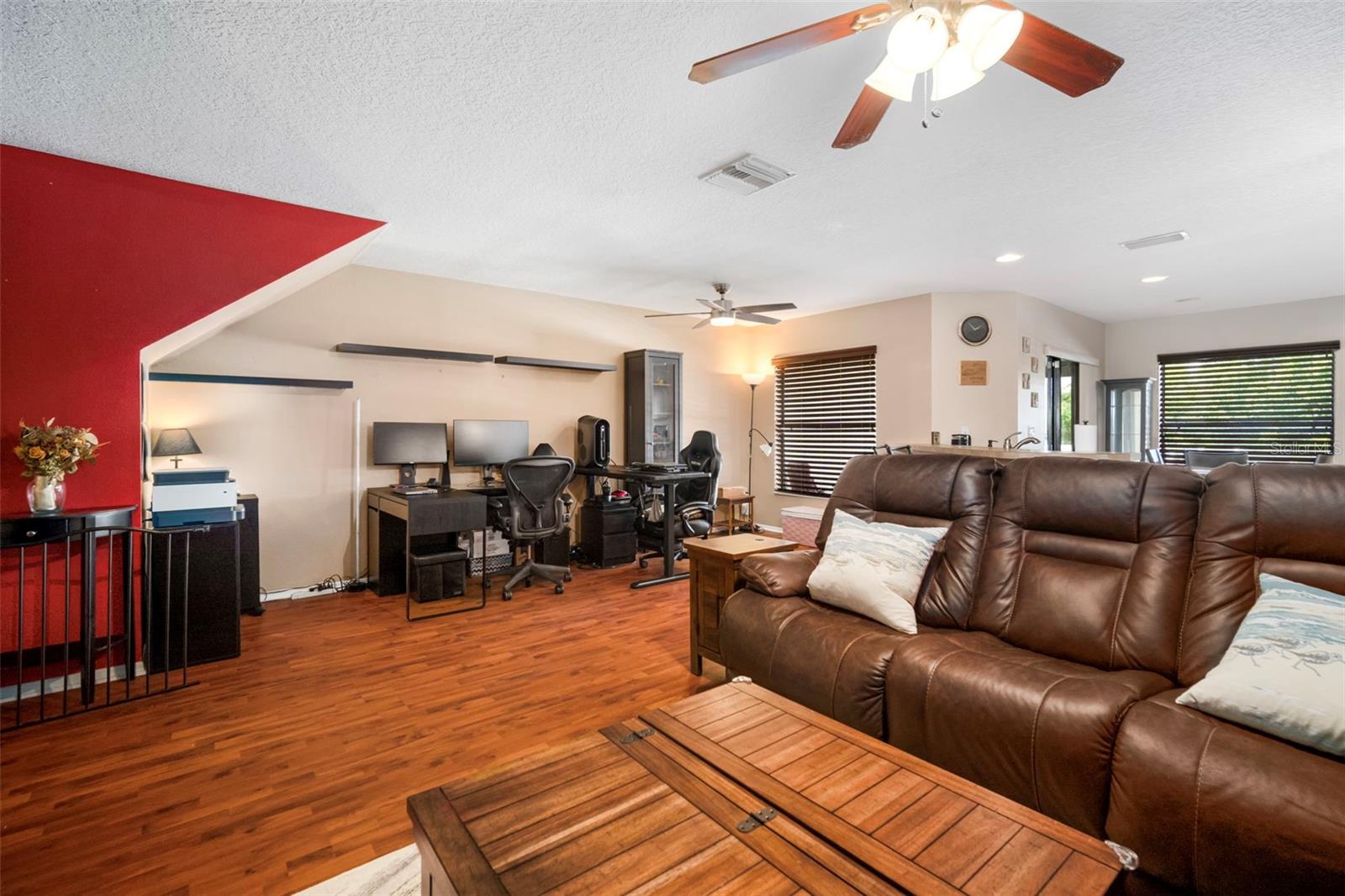 Spacious family room with plank flooring