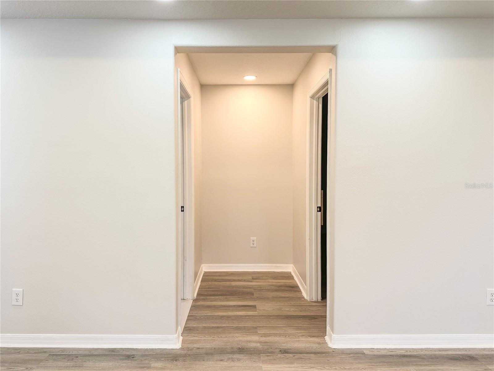 primary bedroom go to closet and primary bathroom