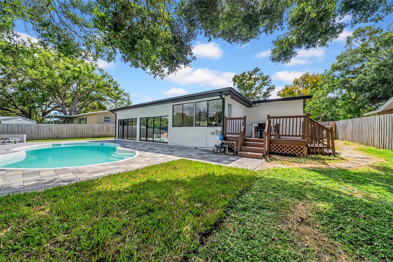 Large fenced in backyard w/outdoor deck