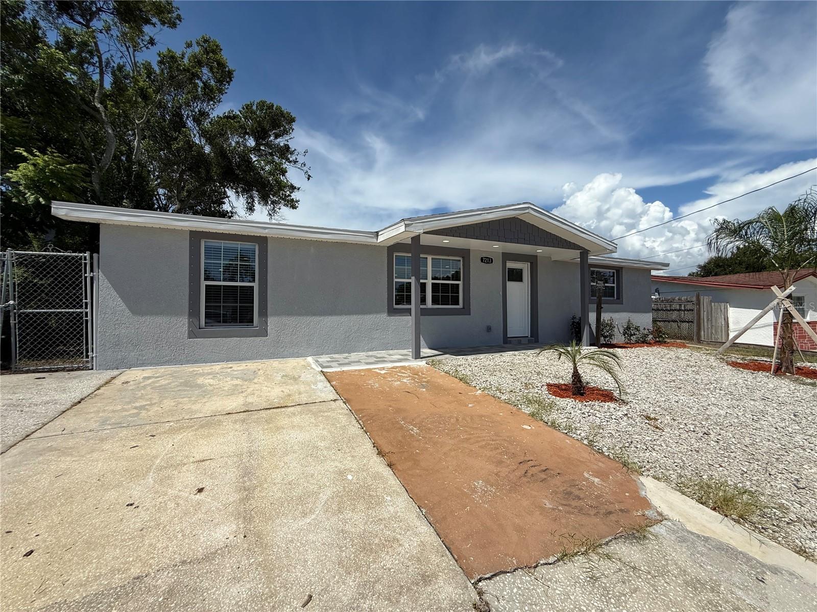 Front view of the fully renovated home with new impact windows