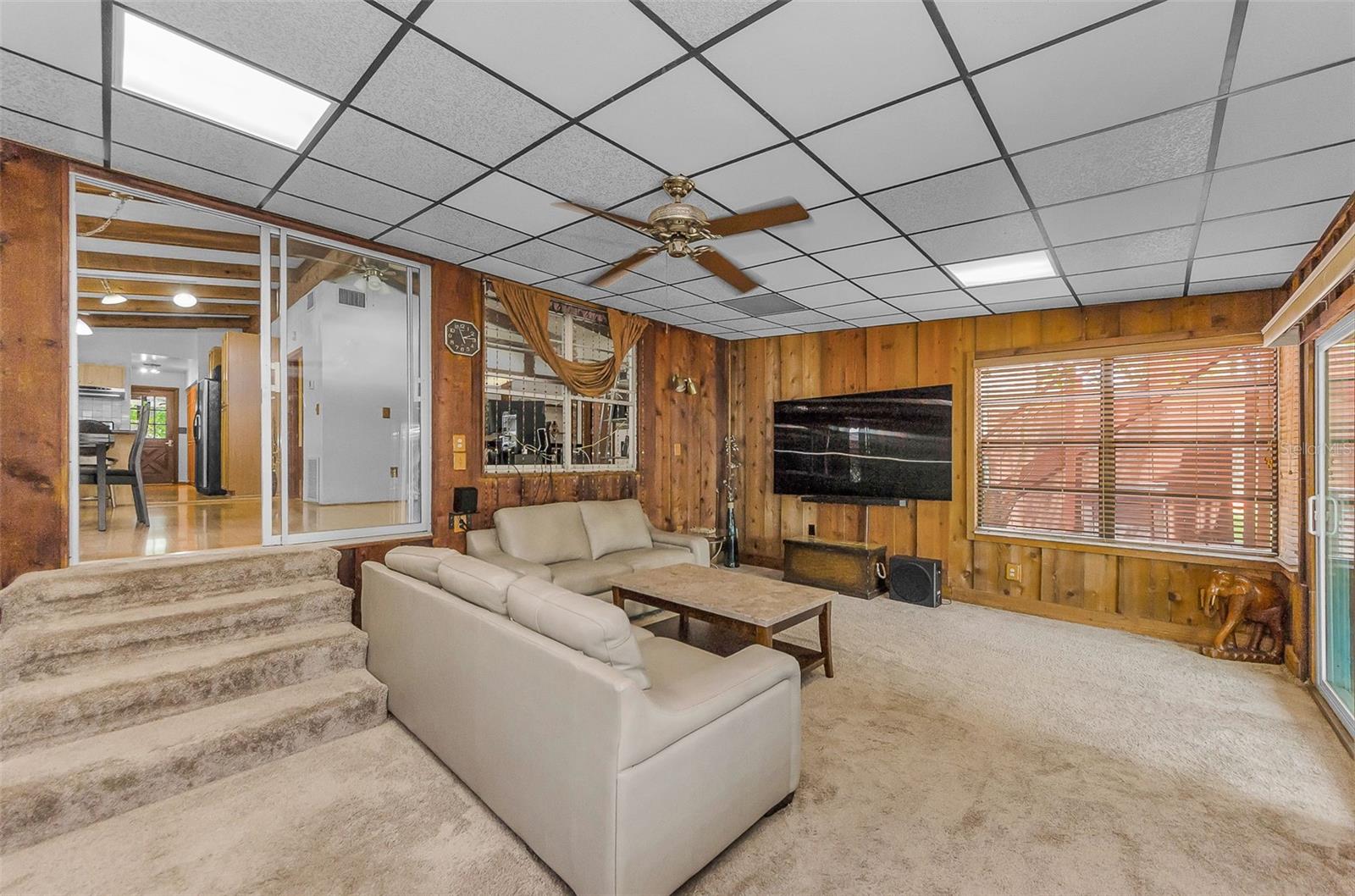 Enclosed Florida room serving as a Living Room