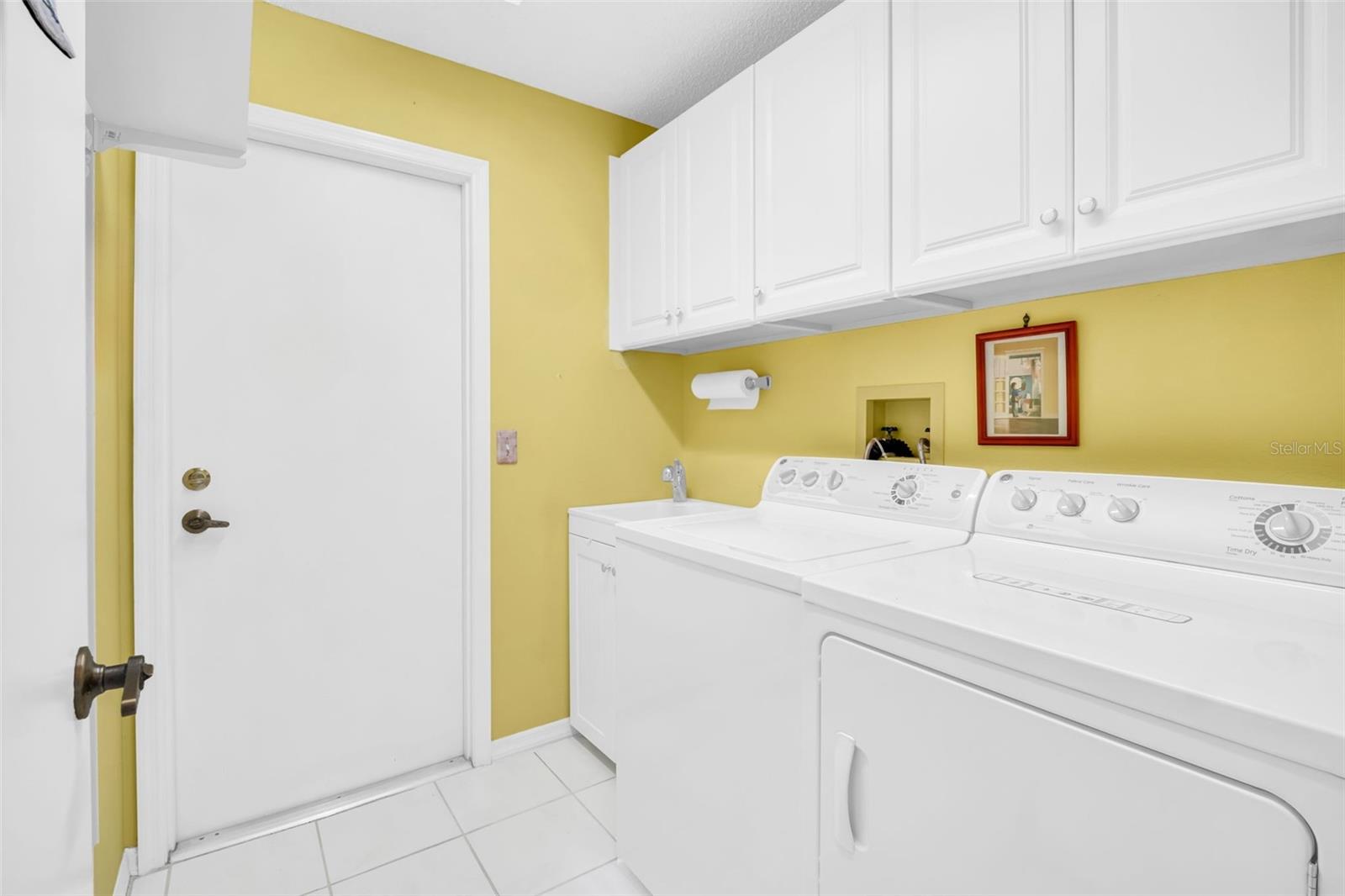 Large indoor laundry room perfectly located between the garage and main living~