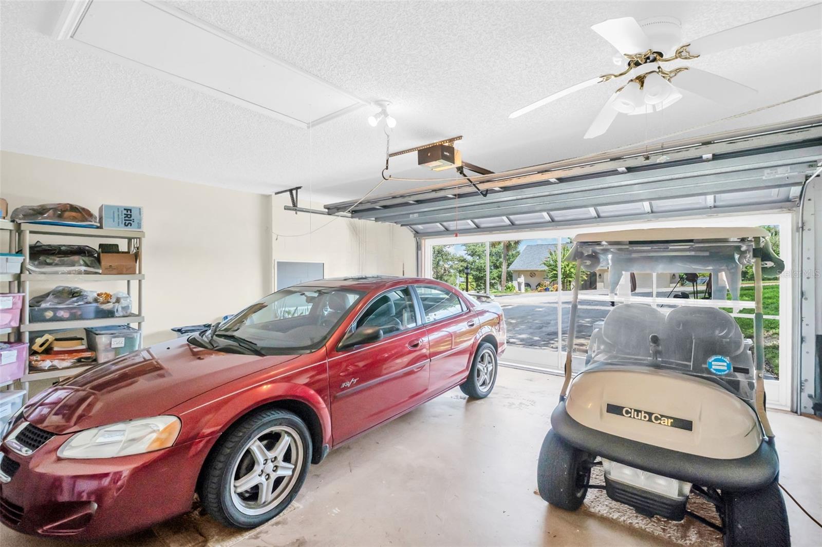 Full 2-car garage big enough for your car & golf car too, plus a newer garage screen~