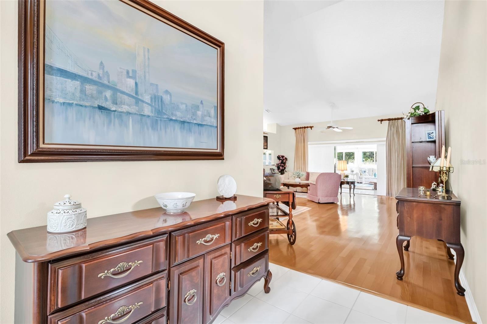 Gracious front entry with immediate soaring vaulted ceilings~