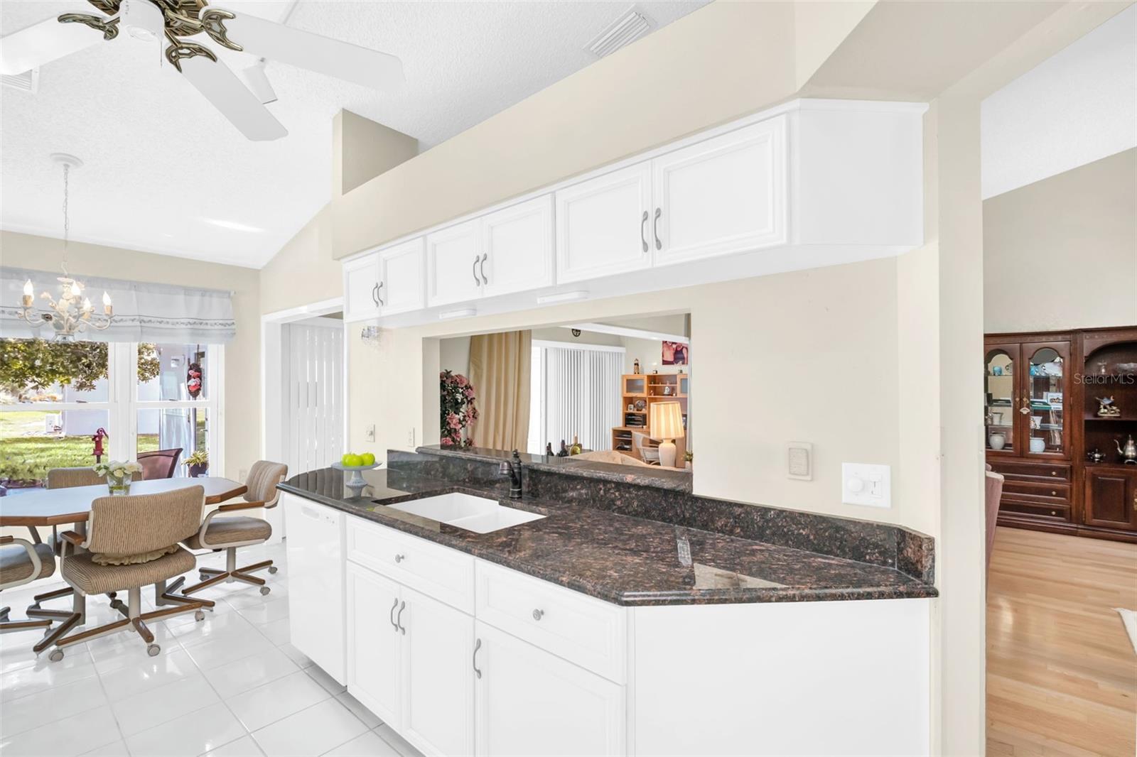 Updated kitchen with granite countertops and updated solid wood cabinetry~