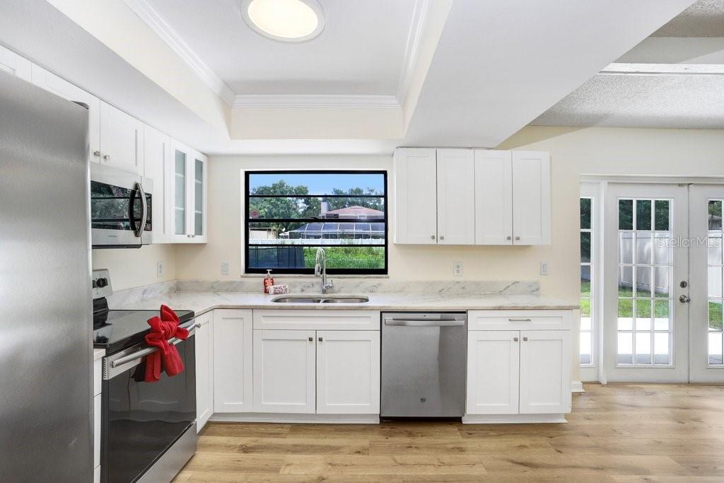 Overlook your backyard oasis while preparing meals!