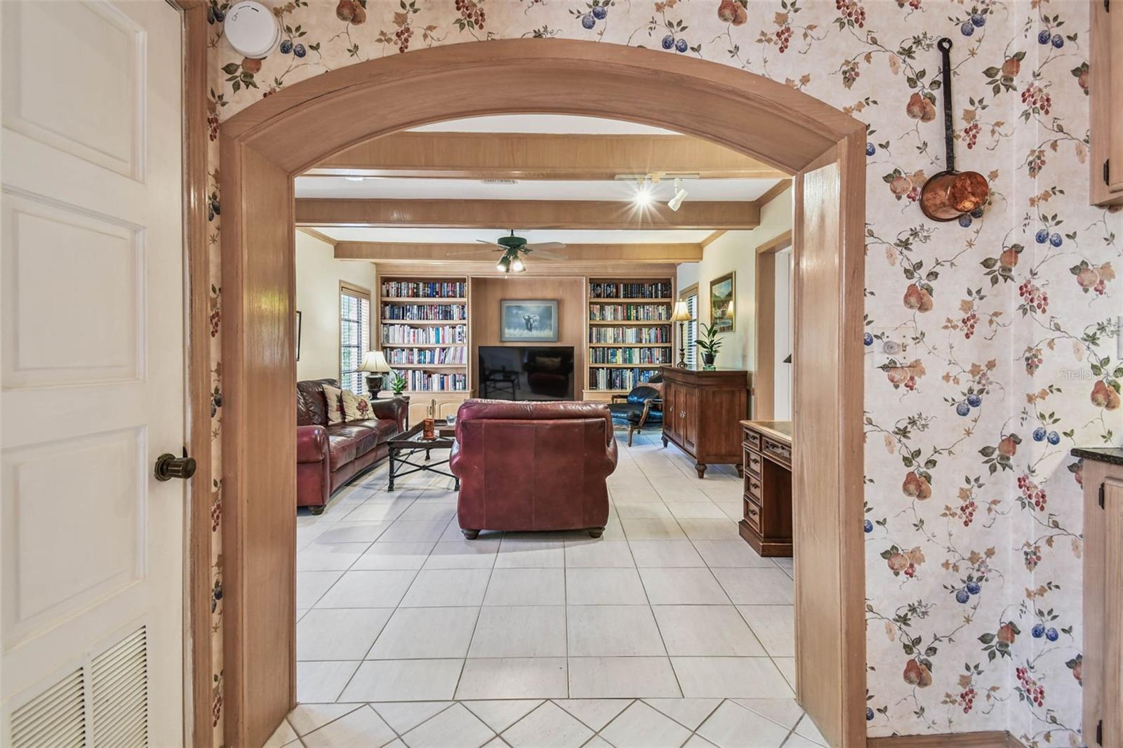 Arched entry to family room from kitchen