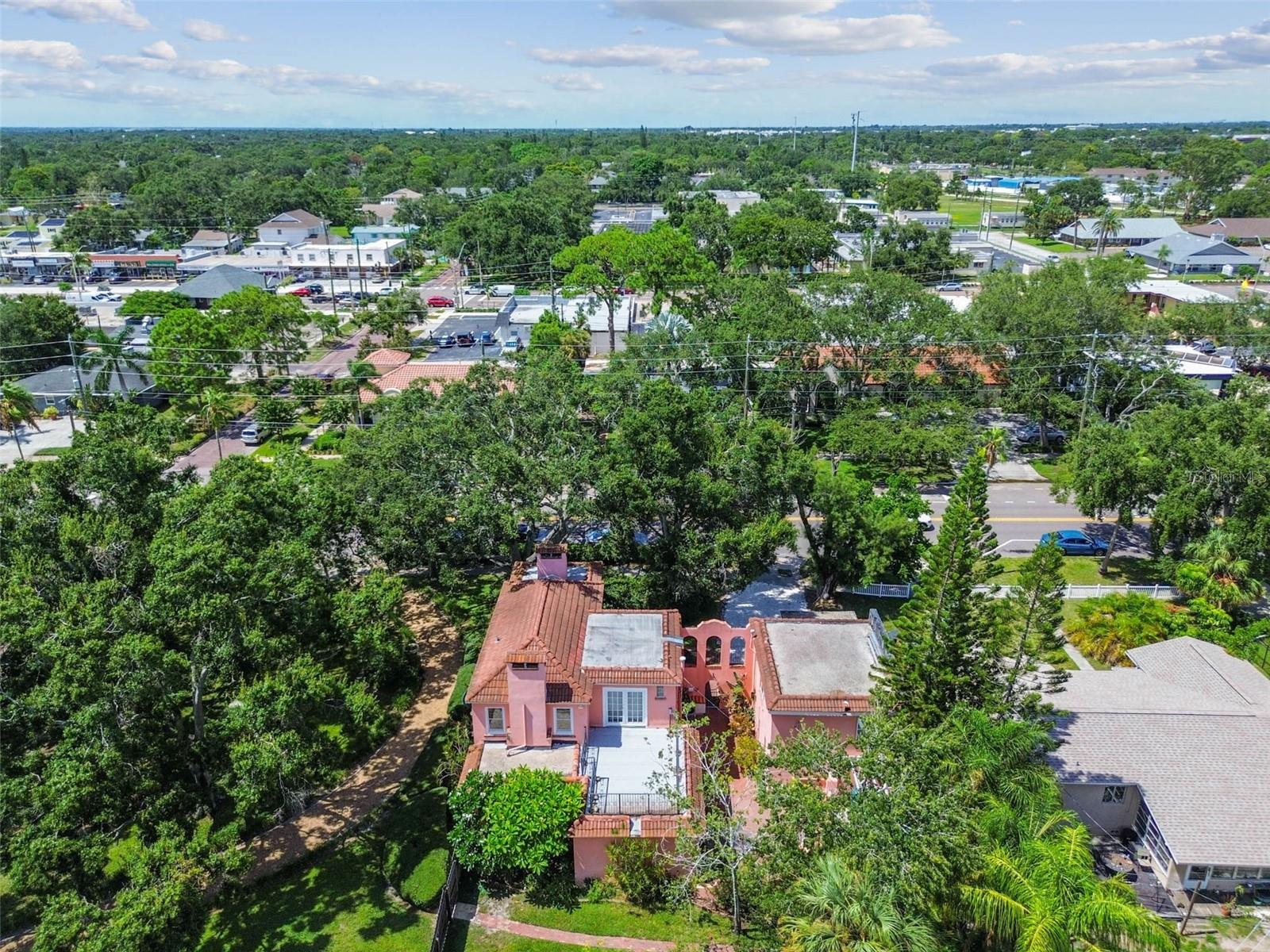 Home surrounded by mature trees and in a lovely neighborhood