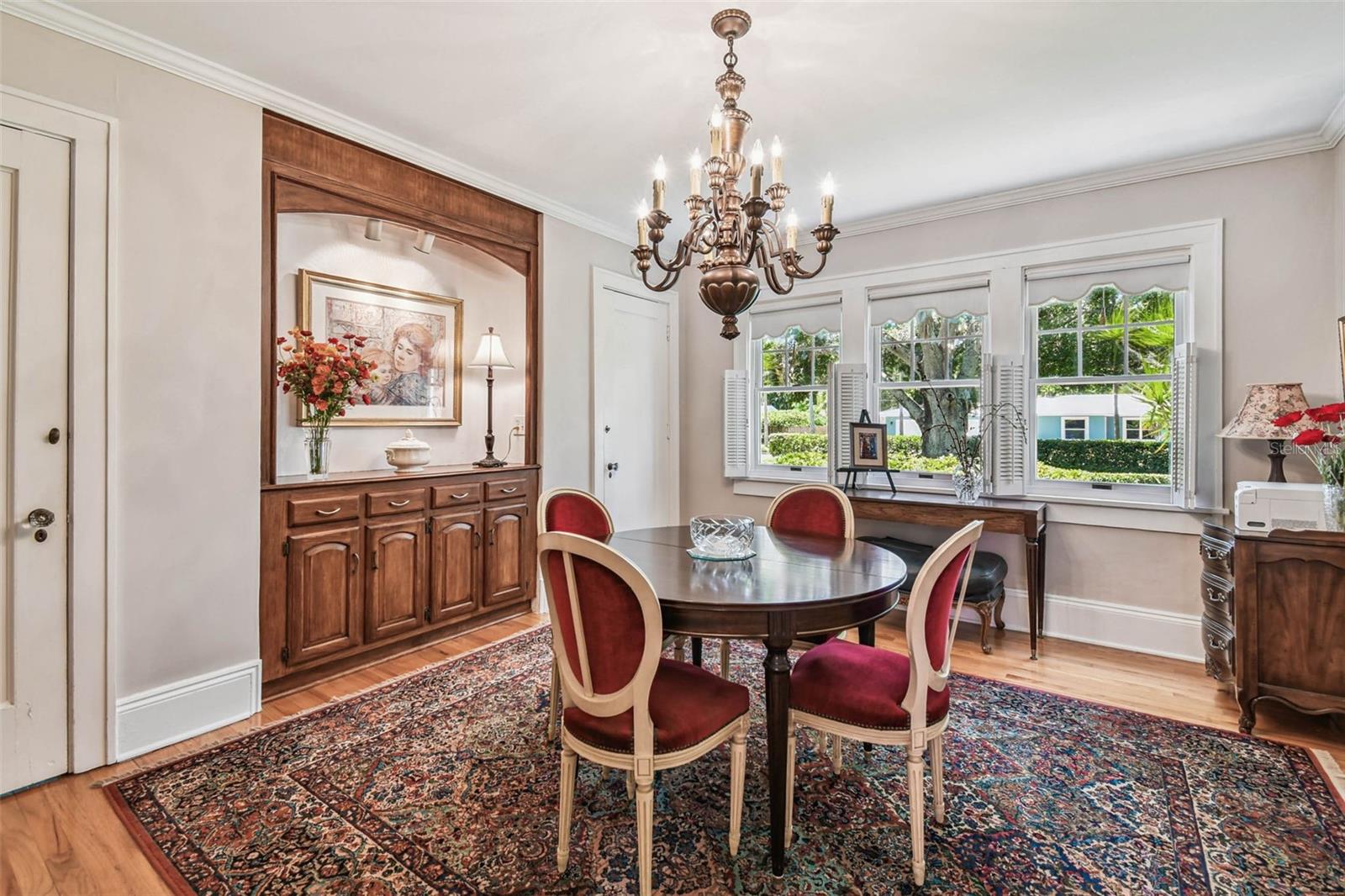 Built-in cabinet/bar and lovely chandelier in dining room. Very spacious