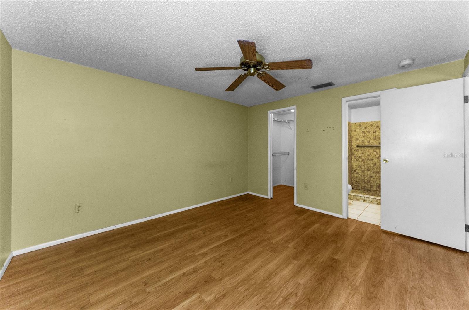 Primary bedroom with walk in closet