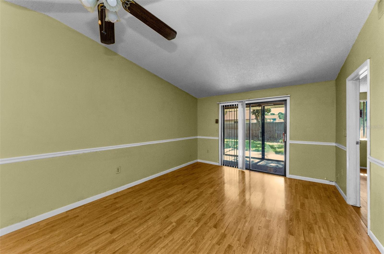 Spacious Living room area with sliders to the sunroom