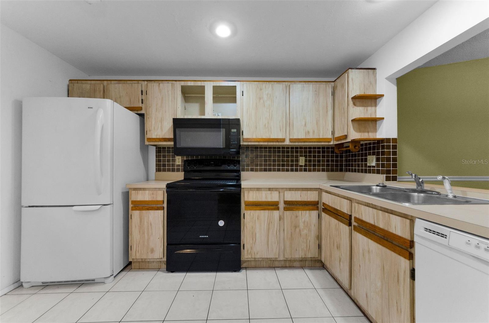 Kitchen is has plenty of cabinet space