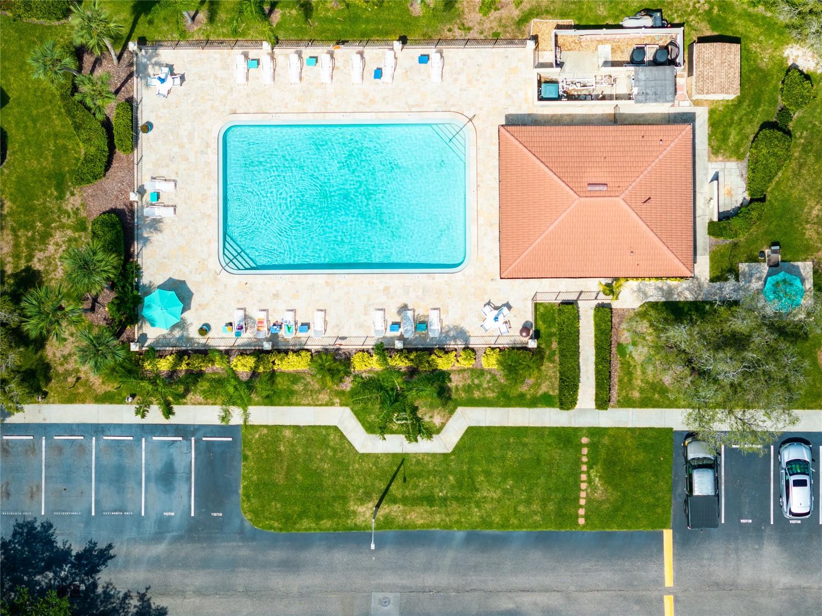 Condo is steps from the community pool.