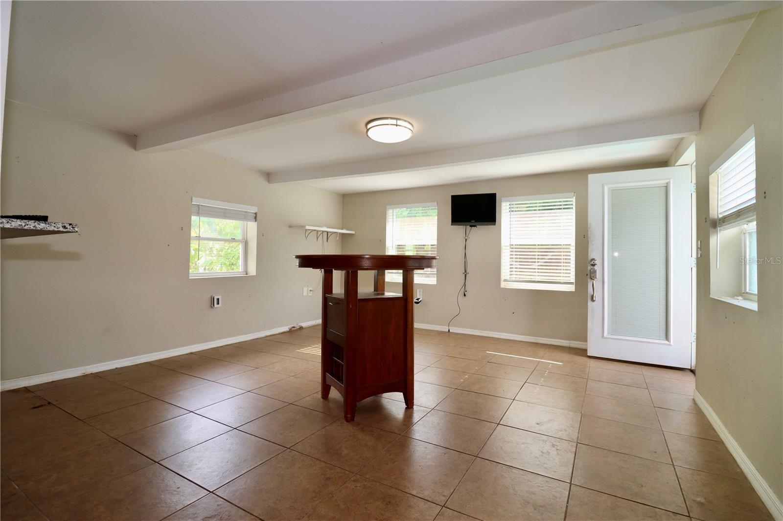 Bonus Room with door going out to pool