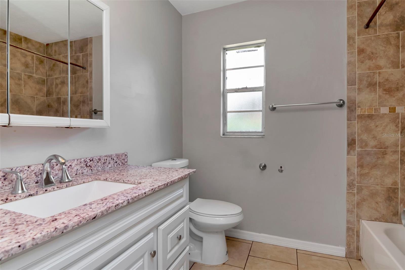 Hall bathroom with granite vanity top