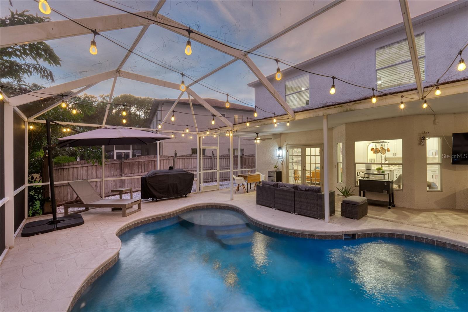 Entertaining under the stars in your screened in Lanai area