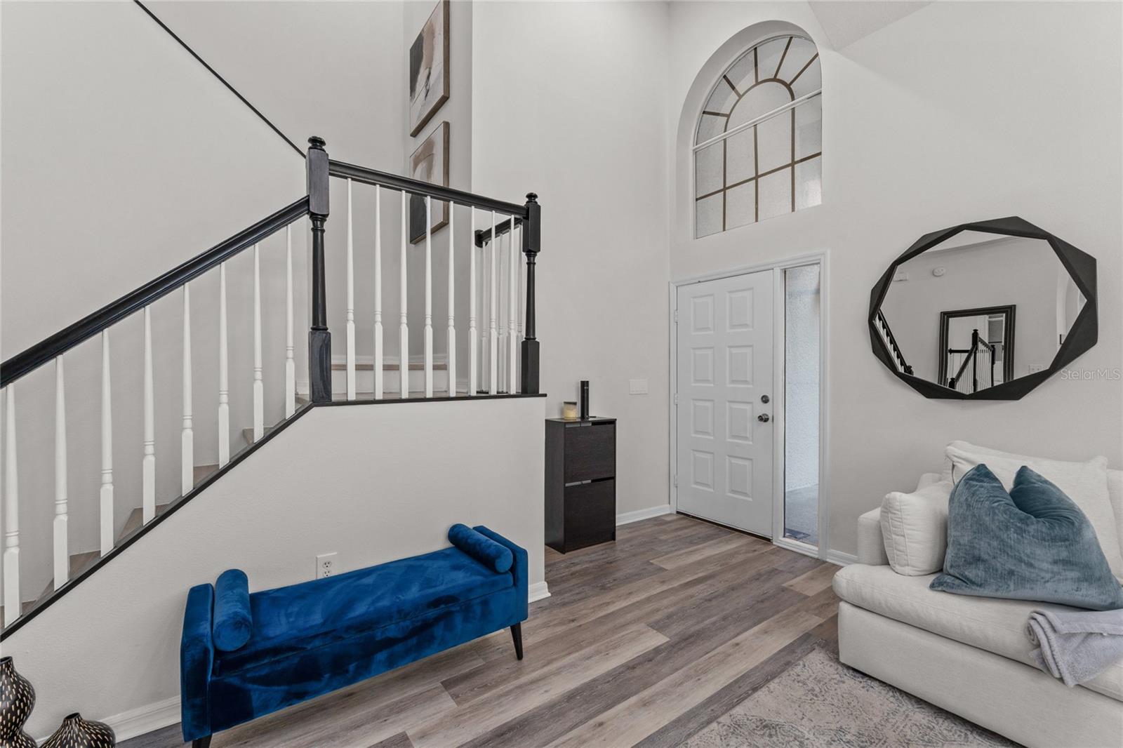 Entryway with dramatic staircase