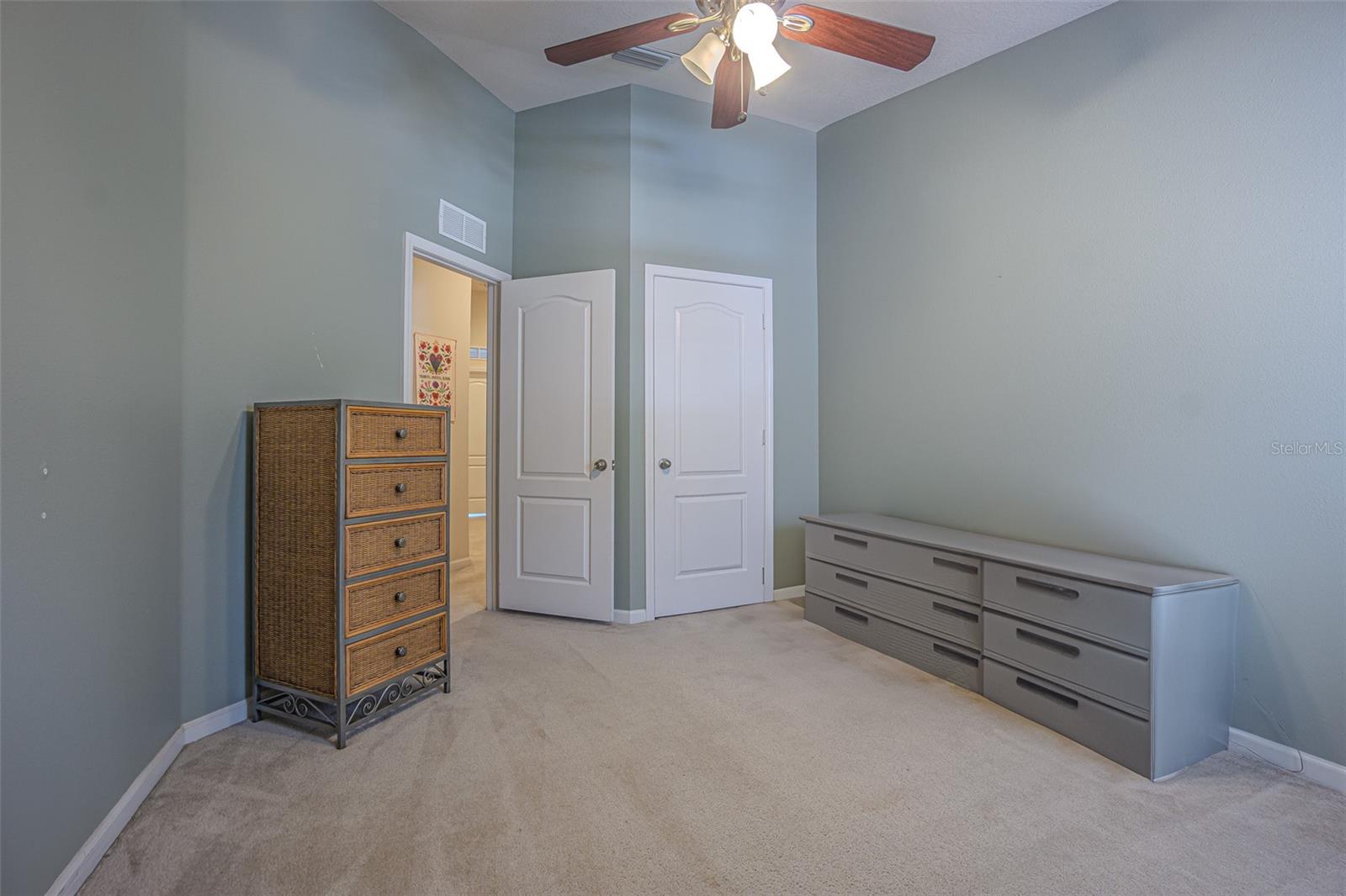 2nd bedroom has high ceilings as well and overlooks interior street parking