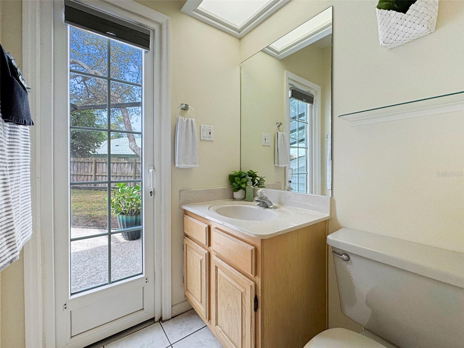 Hall half bath with access to pool
