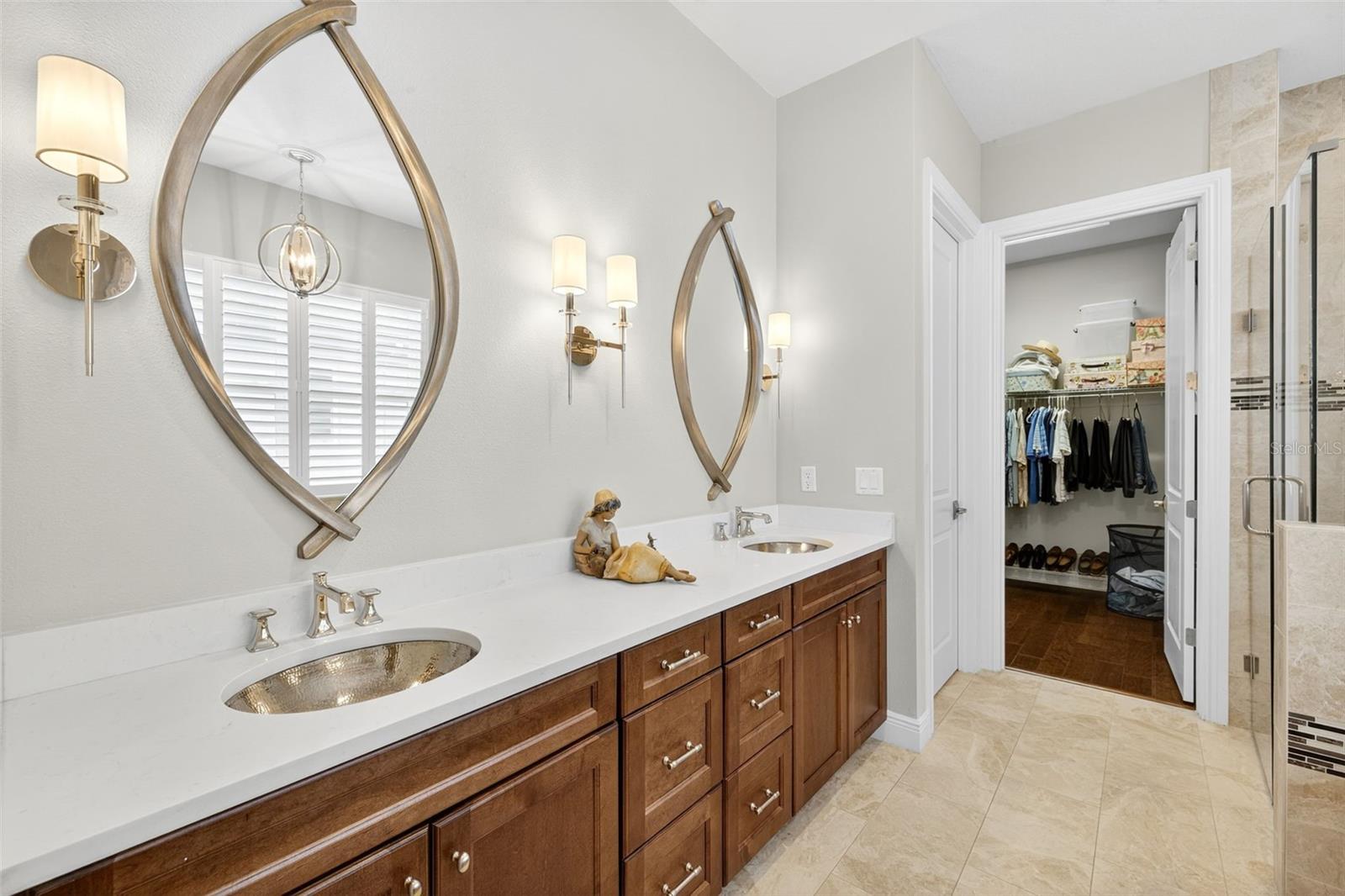 luxury primary bath with large walk in closet