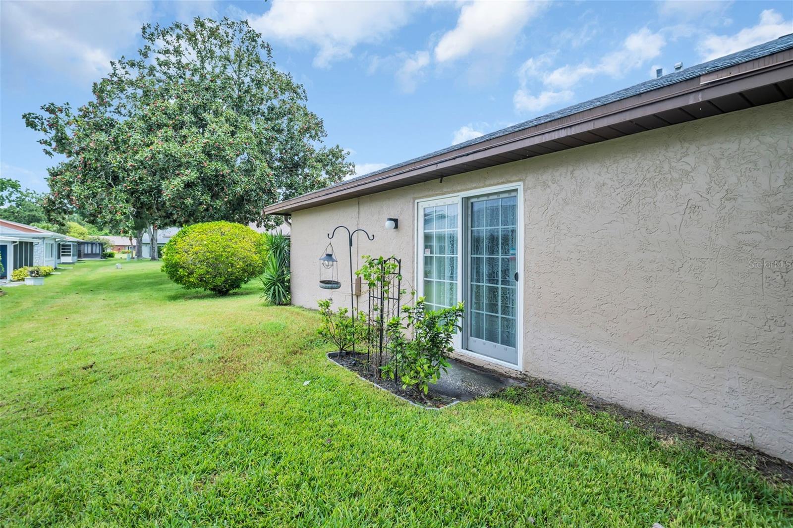 LOVELY LANDSCAPING WITH ROOM TO ADD PATIO FEATURE