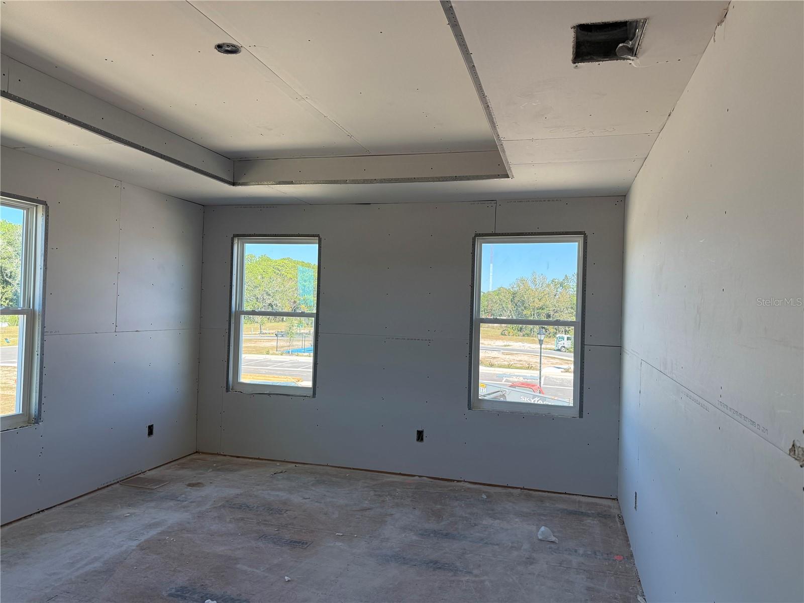 Primary Bedroom is surrounded by oversized windows, providing ample natural light