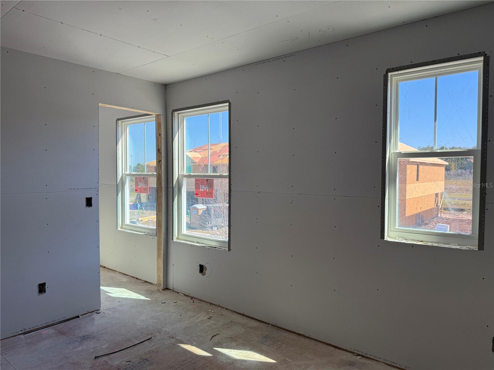Bedroom 2 features a spacious walk-in closet with an extra window