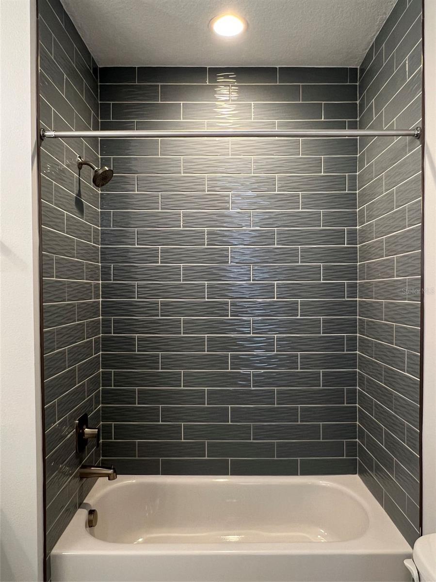 Designer tile to the ceiling