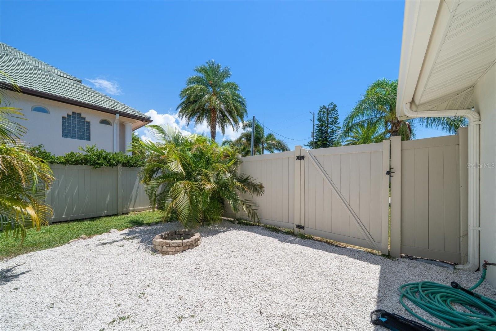 Property is private and has attractive vinyl fencing.