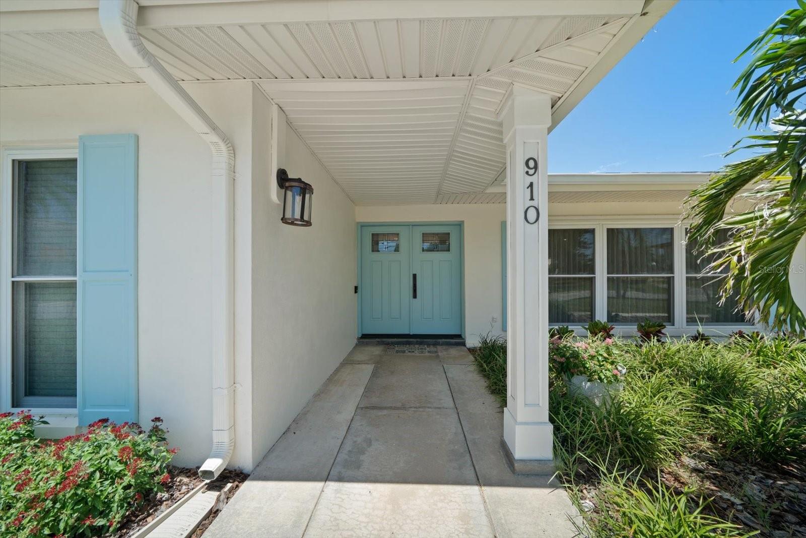 Welcome! Double door entry with attractive raised panels and set in glass for additional interior light.