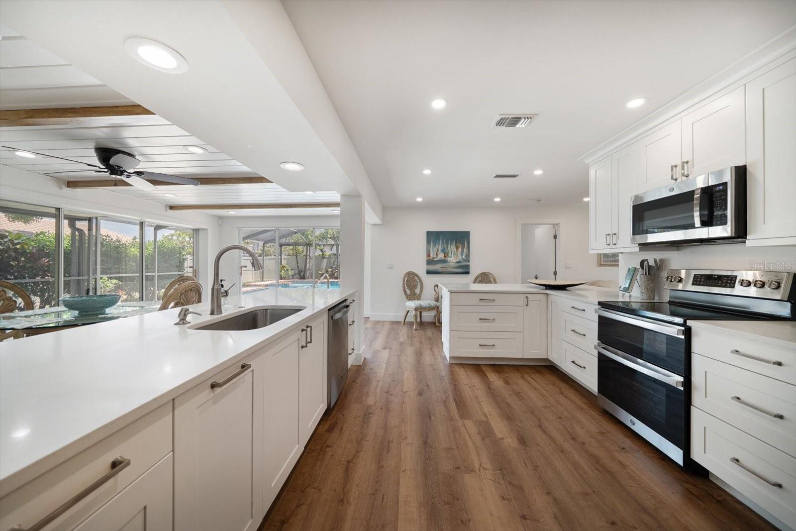 Imagine and enjoy living here! Easy care LVP flooring, several areas to dine informally - a very thoughtful floor plan!