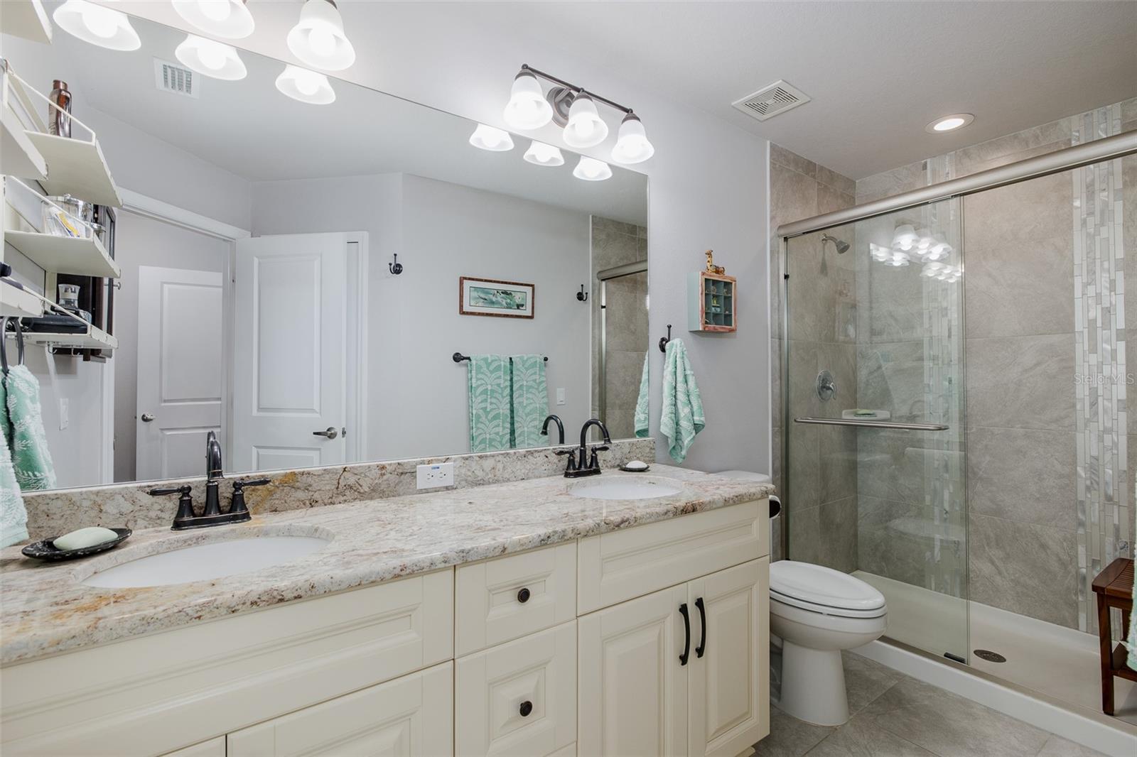 Ensuite primary bathroom with double sinks