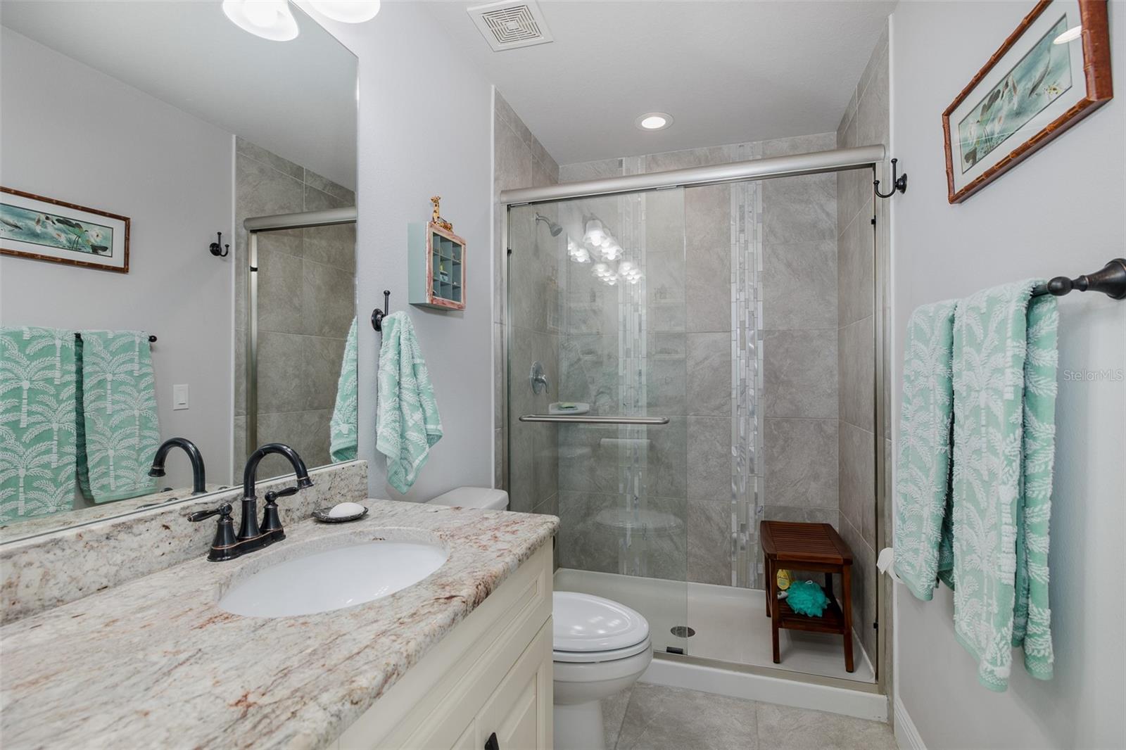 Ensuite primary bathroom with glass shower