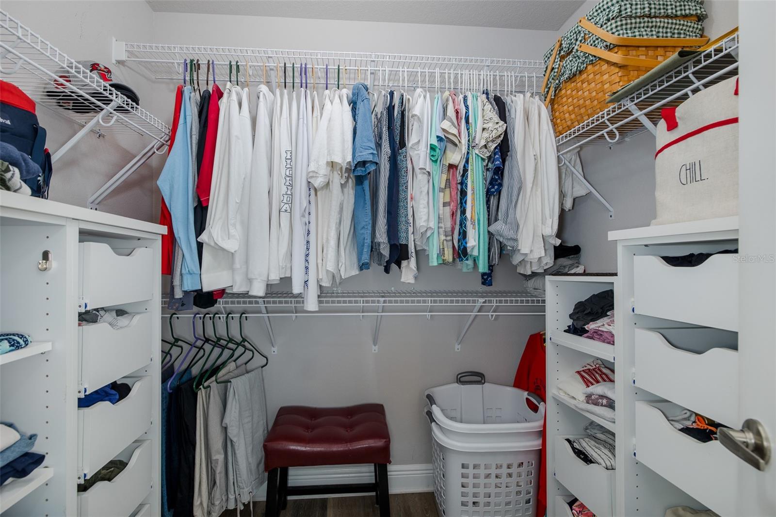 Primary bedroom walk-in closet