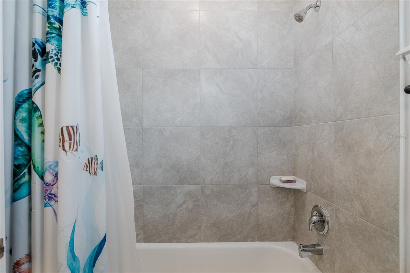 Second bathroom with tub and shower