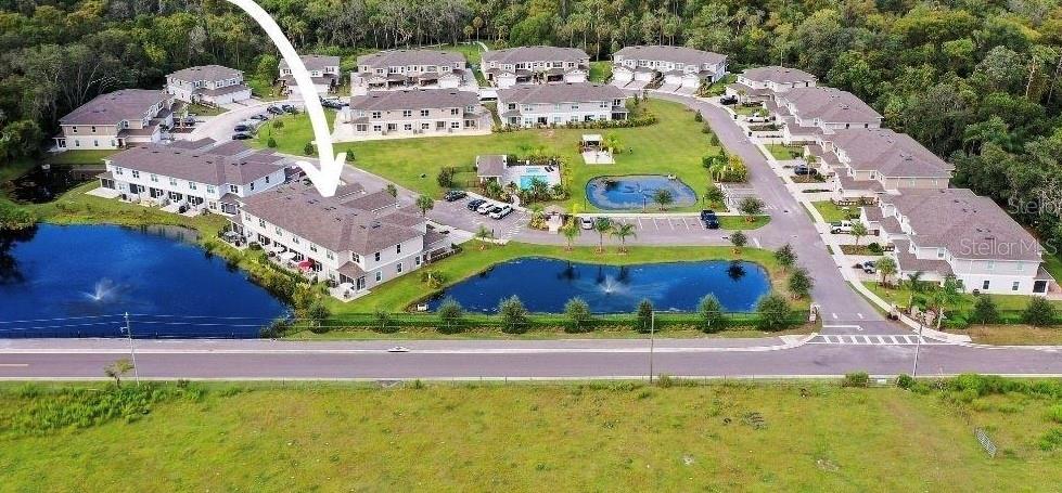 Aerial view of community with home designated by arrow