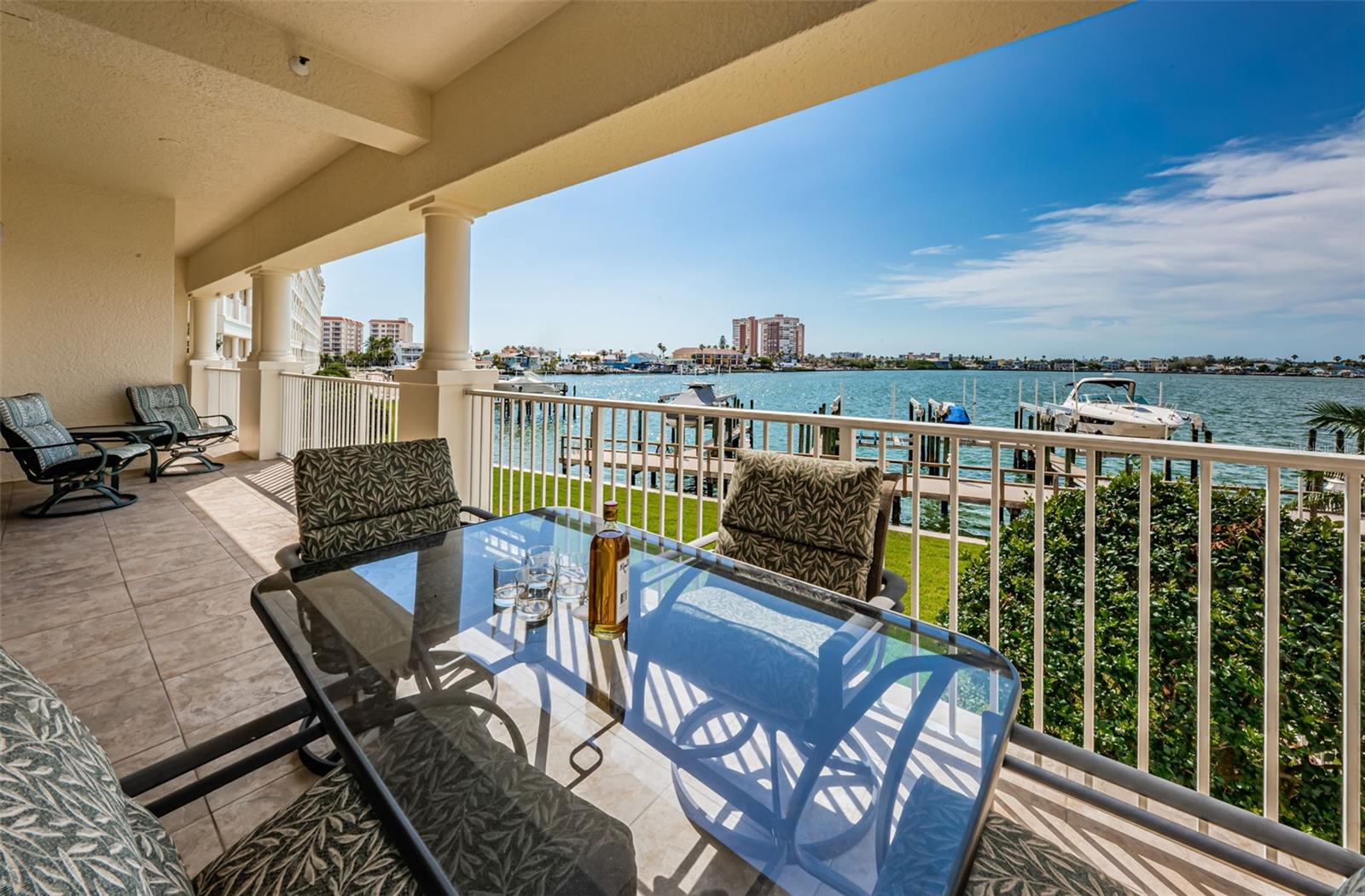 .. Outstanding Water Views...  45' x 7'  Waterfront Balcony.. NOTE:  Balcony Shot Left - with Furniture. This section of Balcony Outside Great Room is 30' X 7'.. Master Suite Balcony Behind Privacy Wall by the Two Chairs is Another 15' X 7'.
