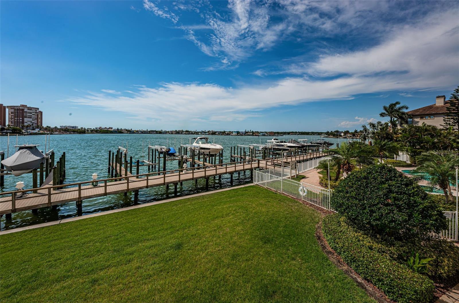 .. View From Residence # 202 Balcony.. Manatees  look for the fresh sweet grass they like that  sprouts periodically and  Dolphins train their Calves in the Protected Waters of Boca Ciega Bay - Dolphins Also Like to Encircle Fish in This Waterway to Feed Their Calves And You Have a Front Row Seat to Enjoy The Activities.