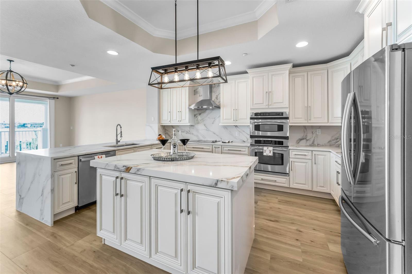 ..... .. Gourmet Kitchen with Tray Ceilings, Complete with Granite Countertops and Upscale Appliance Package.... Kitchen 10' Wide x 15.11 Long. Prep Island in Center for Easy Access.