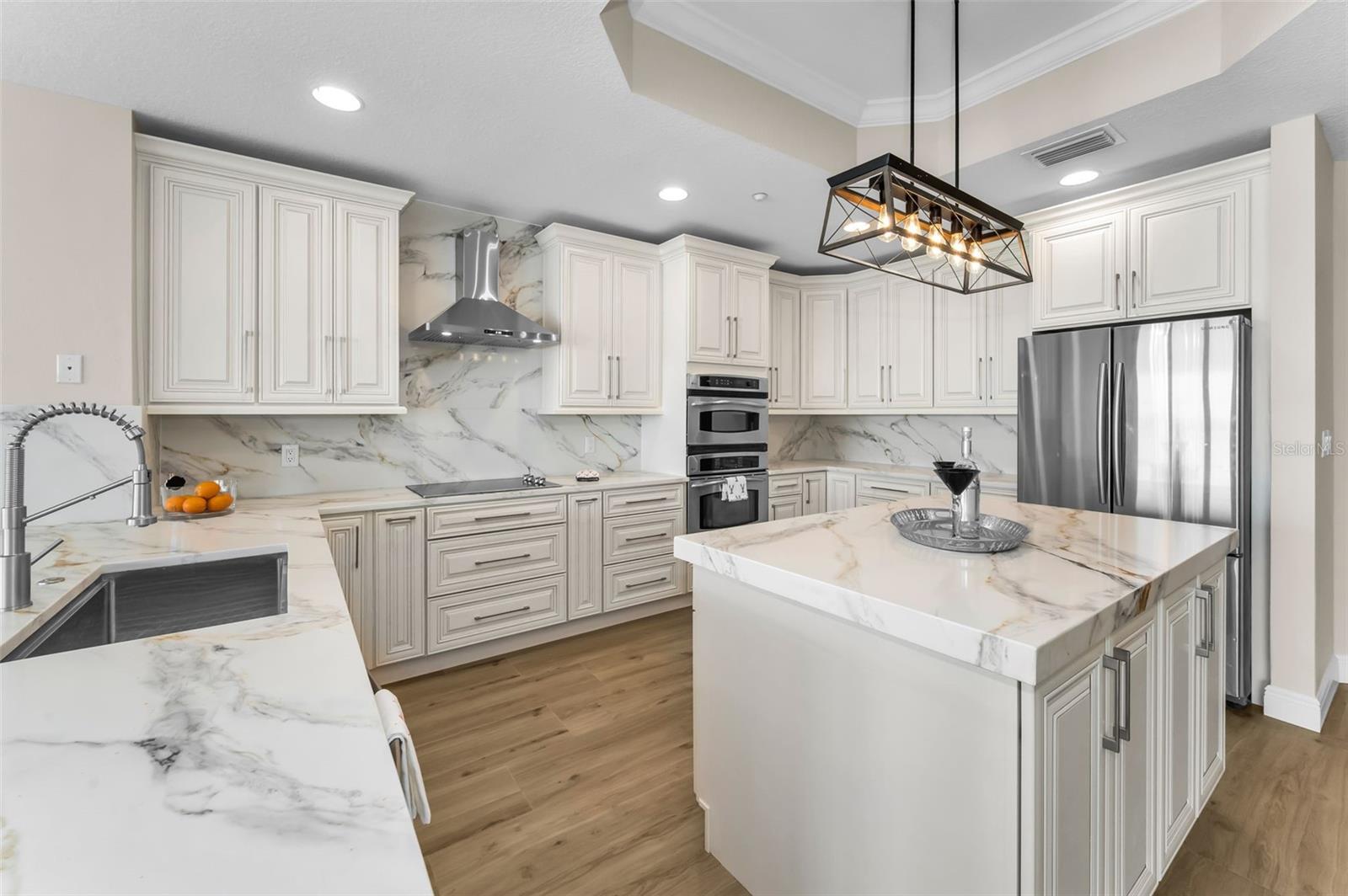 ....Cumberland Pearl Custom Cabinetry - Solid Wood - Soft Close..  Counter Tops & Back Splash - Tivoli Sunrise Quartzite  Level 5 With Mitered Edge