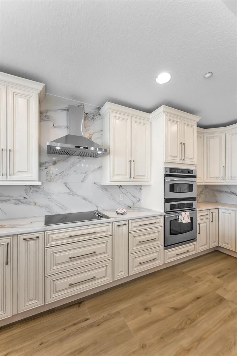 .. Modern Design W/ Plenty of Cabinet & Drawer Space. Beautiful Tivoli Sunrise Back Splash.