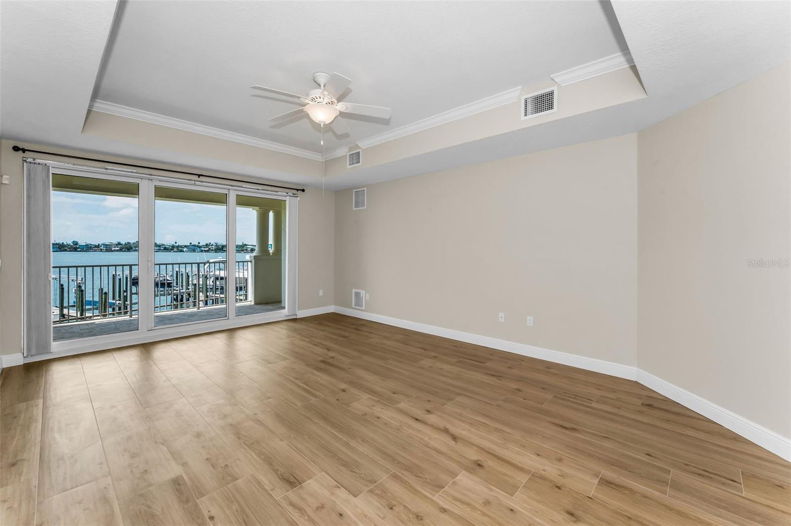 ...High Tray Ceilings Compliment  Grand Master Suite .. Looking Towards Waterfront Balcony..