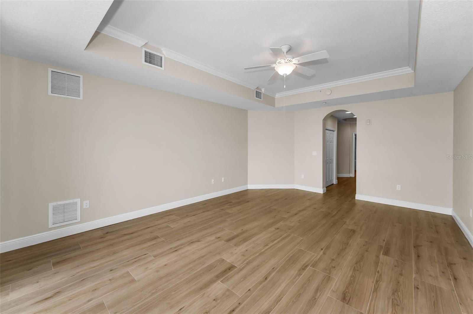 ... Master / Primary Suite Looking In. There are Two His & Hers Walk in Closets ( WIC ) Between Bedroom & Master Bathroom.