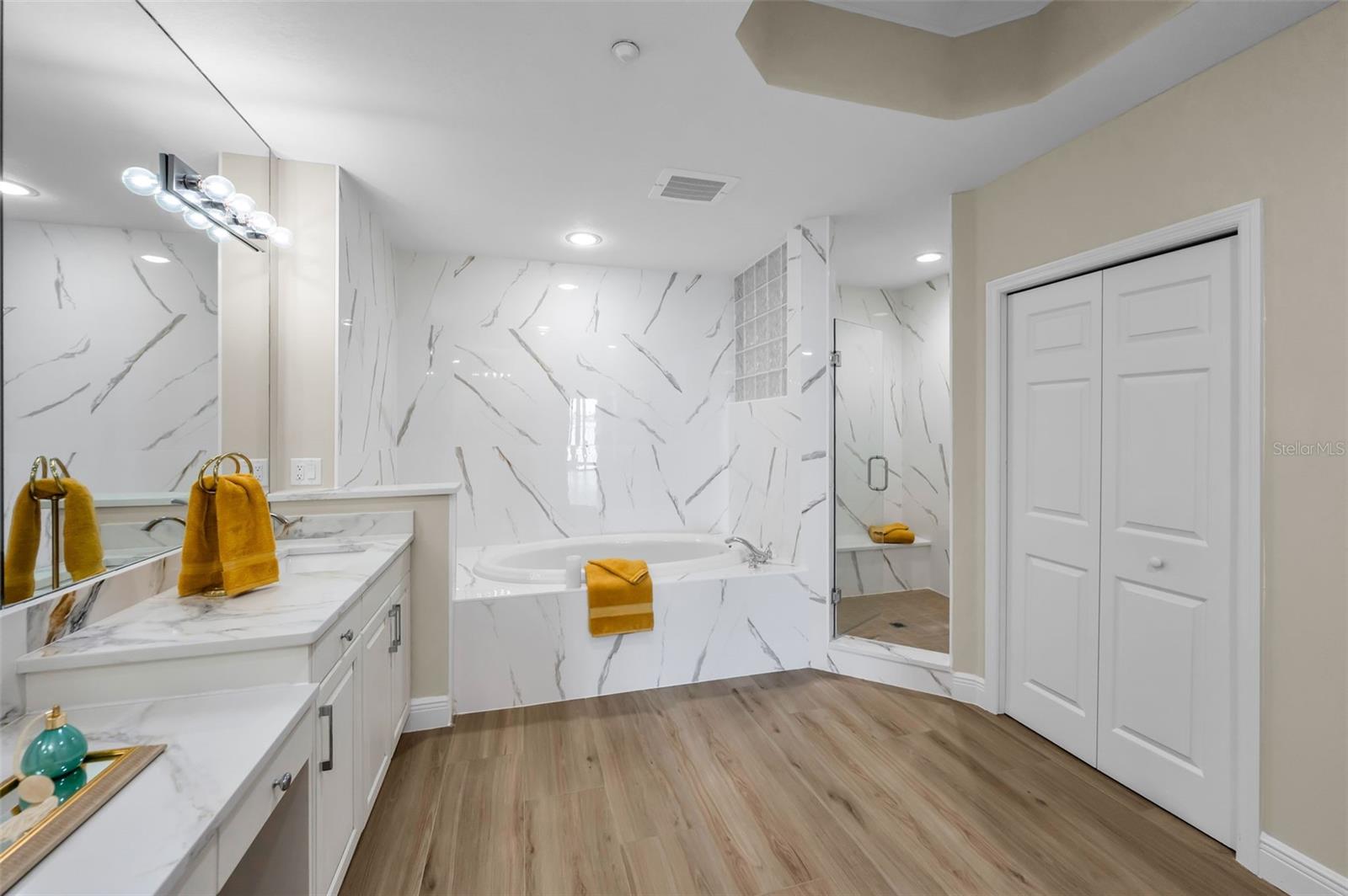 ....Large Master Bath -  SICILIA II Polished Porcelain Tile compliments the  Double Vanity, Prep Area, Spa Soaking Tub, Walk-in Shower and Privacy Room. The Irish Use the Word ' FOIRFE ' Meaning Perfect.