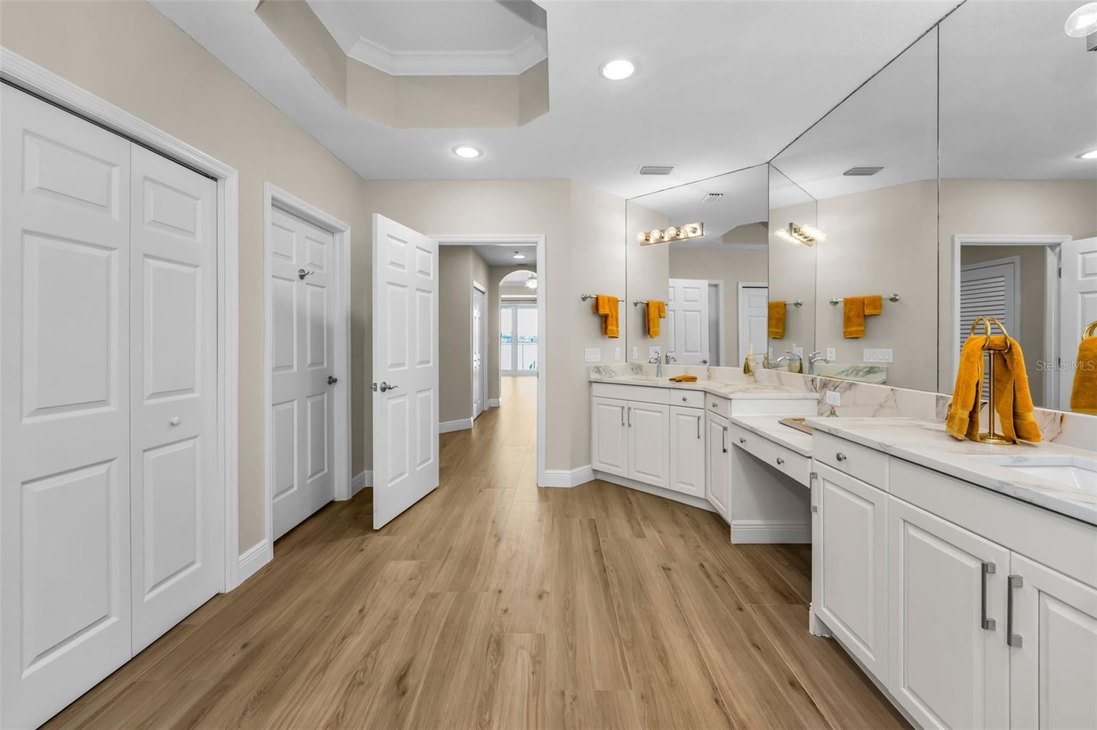 .. Nice Sized 13' X 15' Master Bathroom  ..  Privacy Room & Closet  on Left...Shot Looking Right Through into the Master Bedroom. Spa Soaking Tub and Walk In Shower Behind Photographer... Lighting is Perfect for Prep Area.